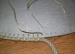 Photo: sewing the rope edge to the shield edge