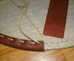 Photo: Sewing the leather edge to the shield edge